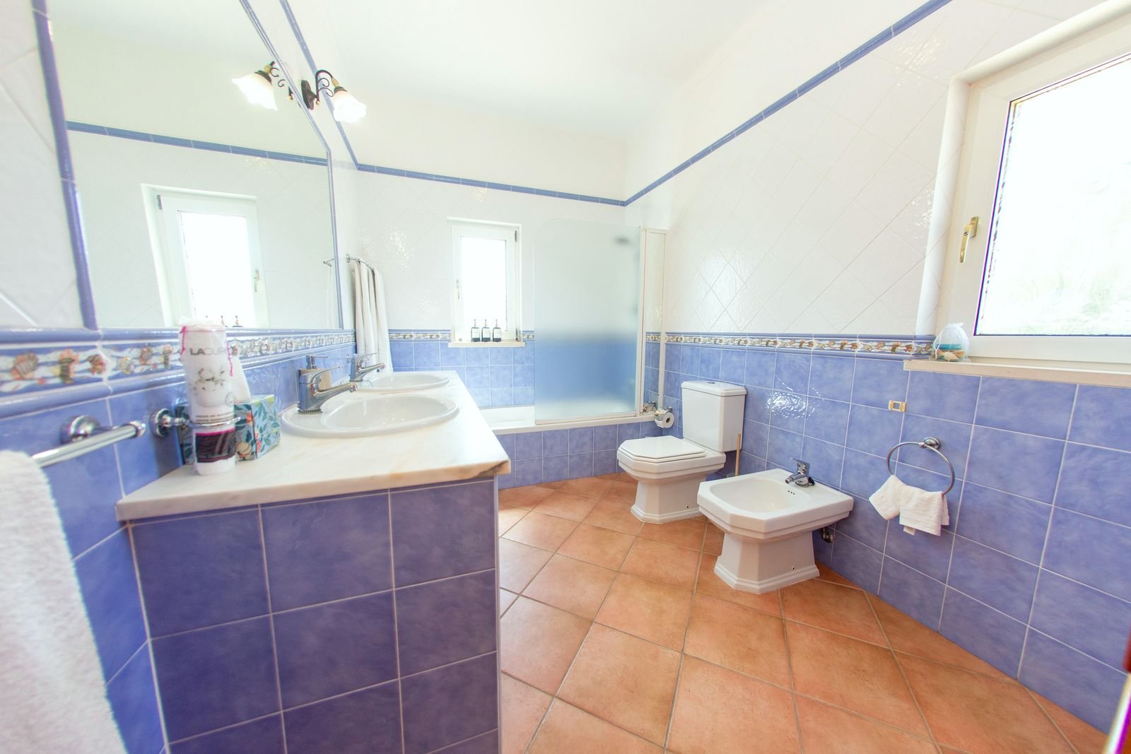 First floor bathroom with double sinks, a bath and a bidet