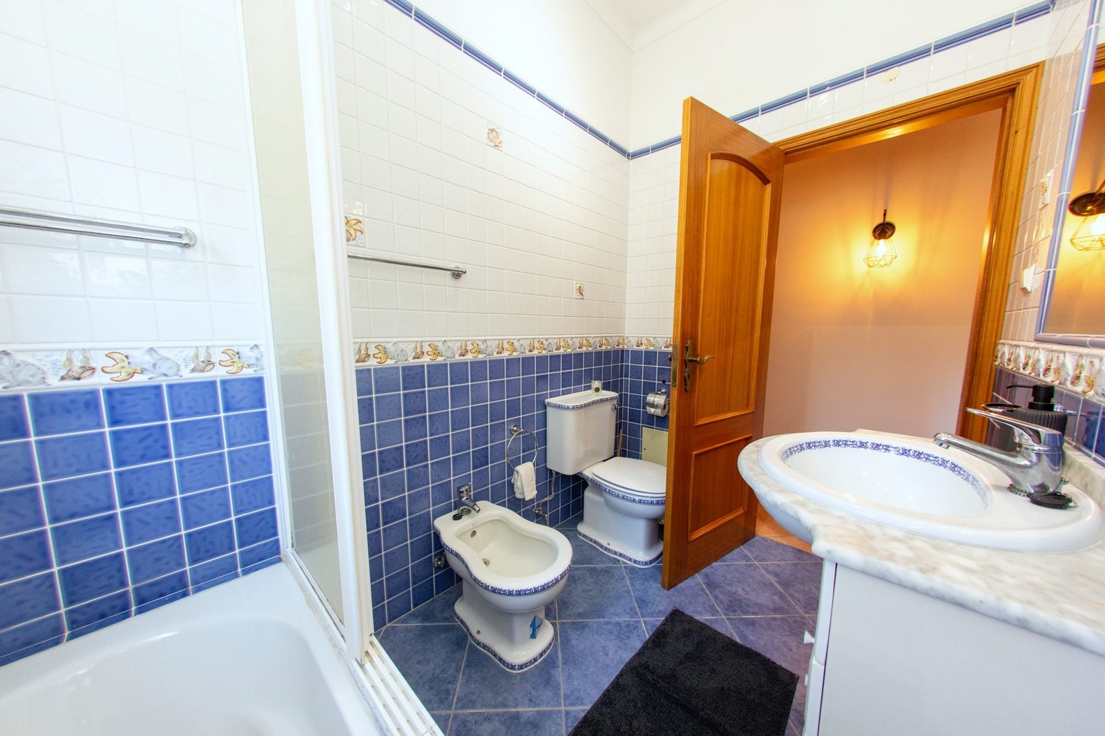 Ground floor bathroom with bath, marble sink, toilet and bidet