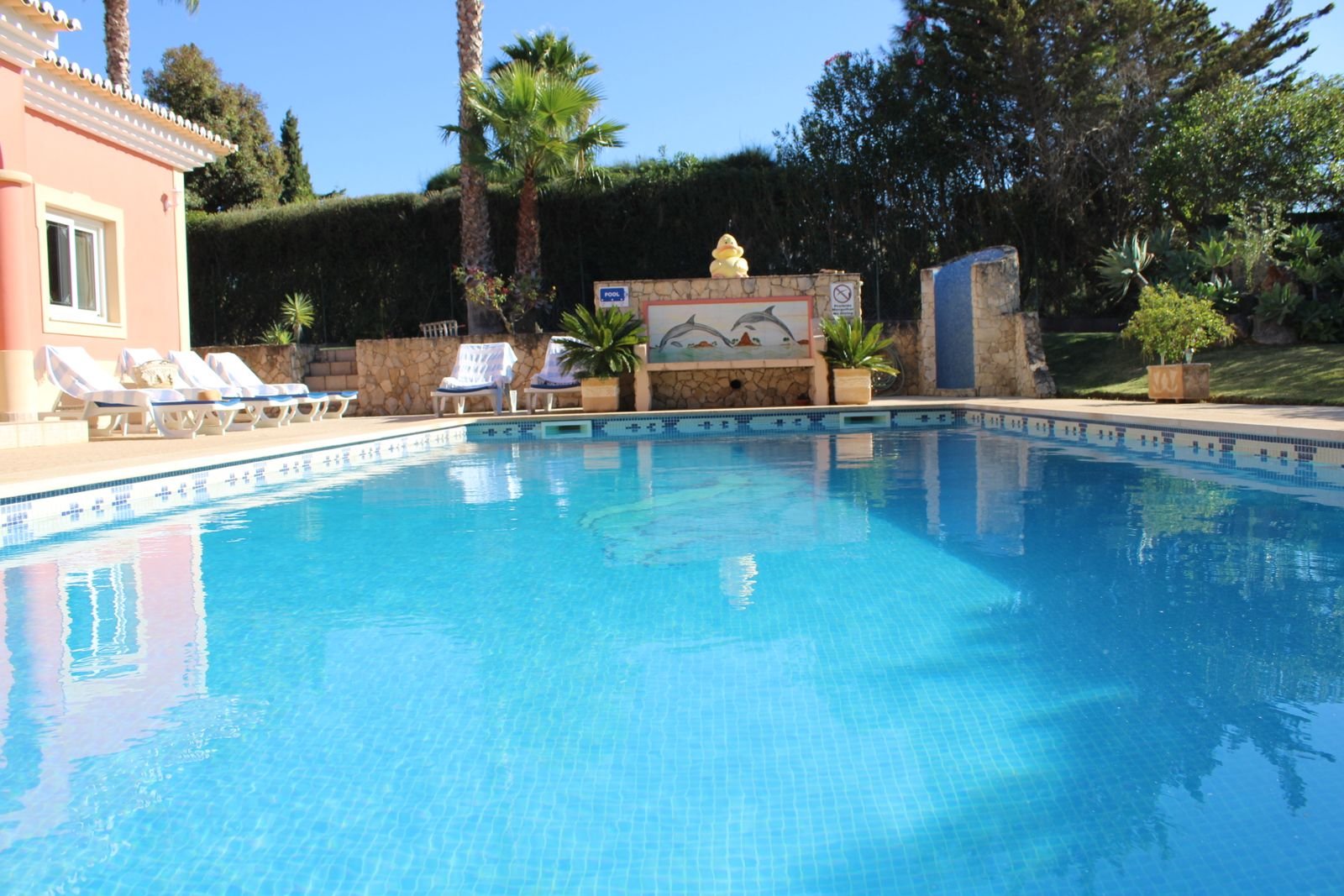 Private swimming pool with sun loungers at Casa Eunice, Carvoeiro, Algarve